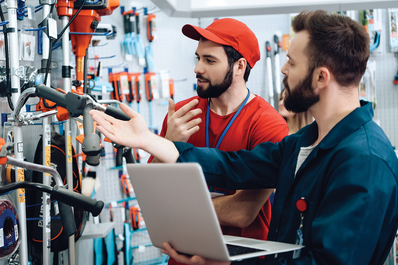 two men looking for tools in a hardware store.